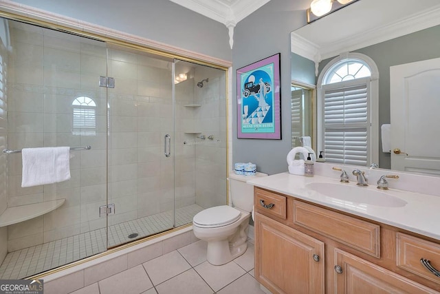 bathroom with tile patterned flooring, vanity, toilet, walk in shower, and ornamental molding
