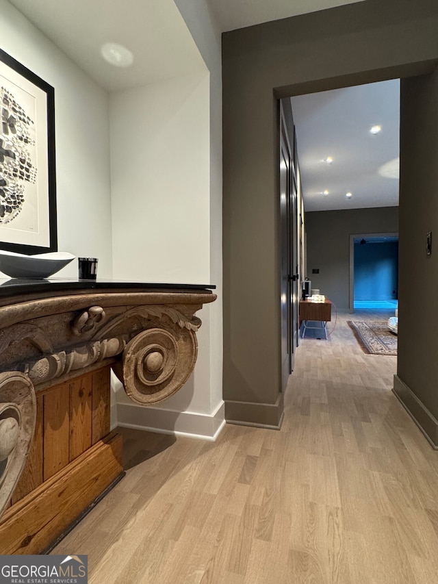 corridor featuring light hardwood / wood-style floors