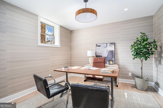 home office with hardwood / wood-style floors