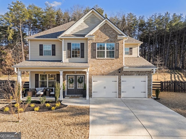 view of front of property with a garage and a porch