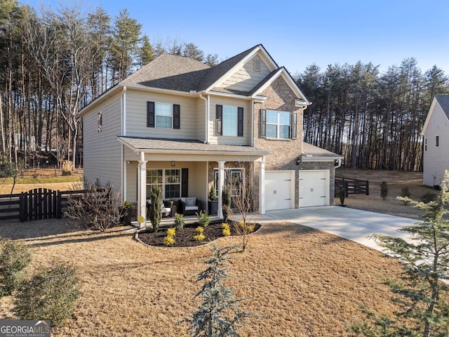 view of front of house with covered porch and a garage