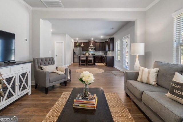 living room featuring dark hardwood / wood-style floors and ornamental molding