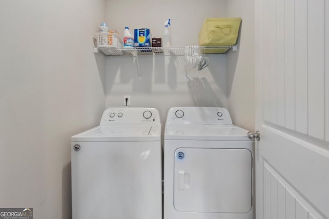 washroom featuring washer and dryer