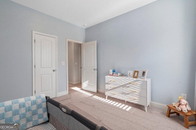 bedroom with light carpet