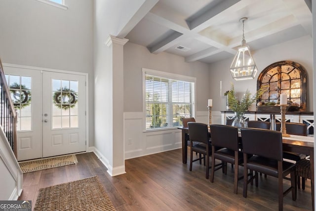 dining area featuring coffered ceiling, dark hardwood / wood-style floors, a notable chandelier, french doors, and beam ceiling