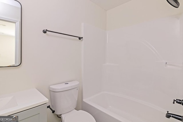 full bathroom featuring toilet, vanity, and bathtub / shower combination