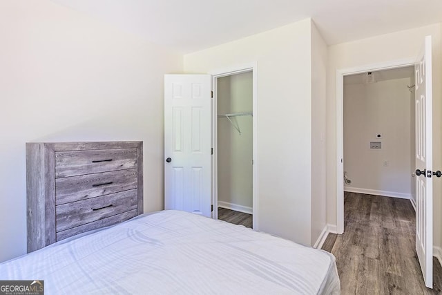 bedroom with a closet and hardwood / wood-style flooring