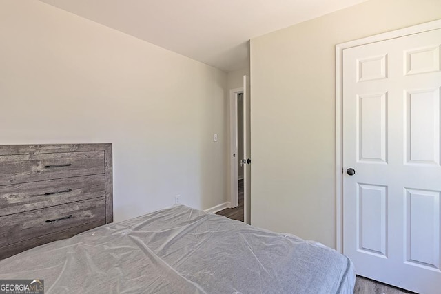 bedroom with hardwood / wood-style flooring