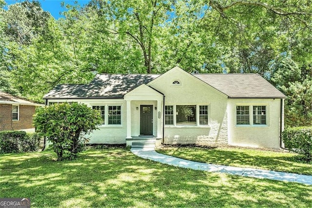 ranch-style house with a front lawn