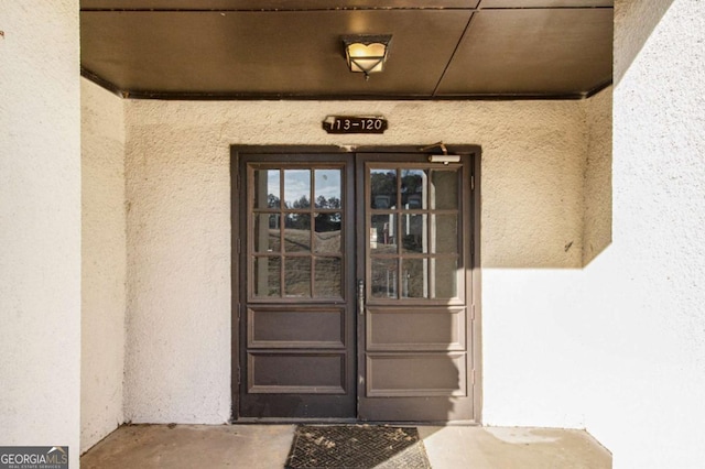 113 Rue Fontaine Unit 113, Lithonia, GA 30038 - doorway to property with stucco siding