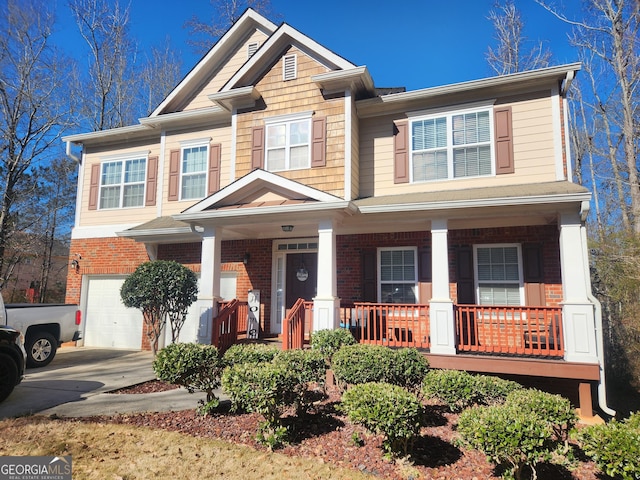 view of front of home featuring a garage and a porch