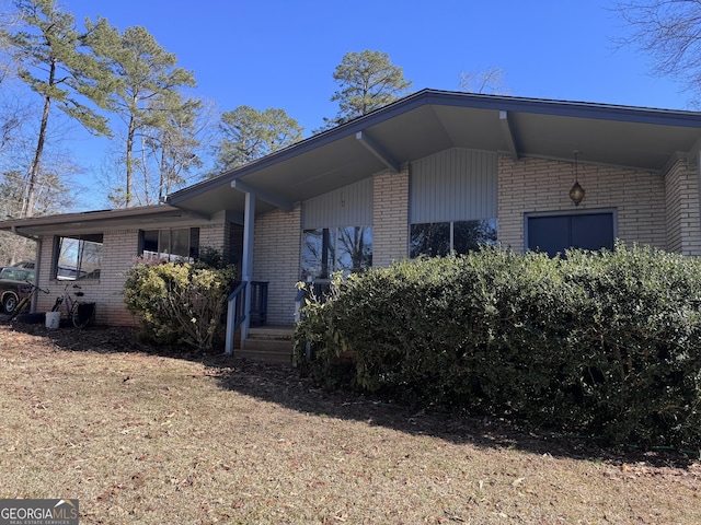 view of home's exterior featuring a yard