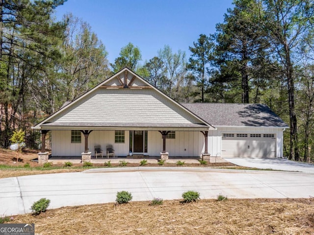 view of front of home with a garage and a porch