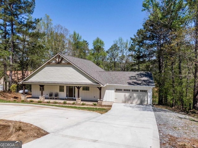 view of front of house featuring a garage and a porch