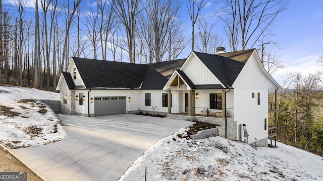 modern inspired farmhouse featuring a garage