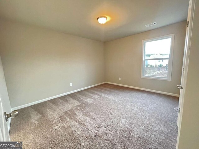 view of carpeted spare room