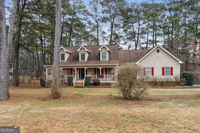 new england style home with a front lawn and a porch