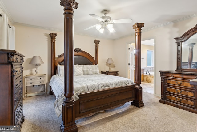 carpeted bedroom featuring ensuite bath, ceiling fan, and ornamental molding