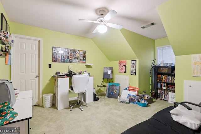 carpeted home office with ceiling fan and lofted ceiling