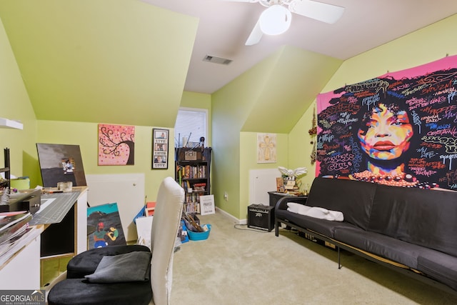 carpeted home office featuring ceiling fan