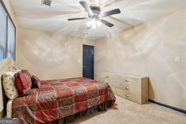 bedroom with ceiling fan and light colored carpet