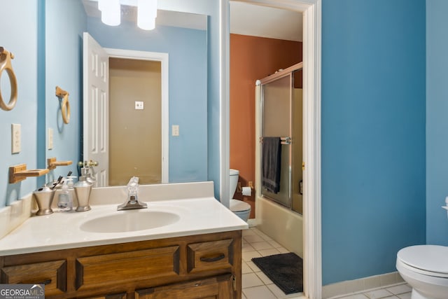 full bathroom with toilet, vanity, tile patterned flooring, and shower / bath combination with glass door