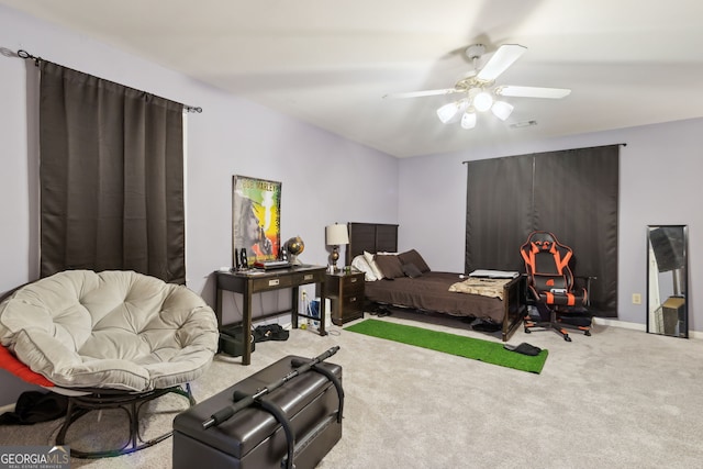 bedroom featuring ceiling fan and carpet