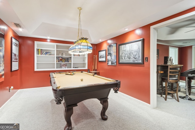 game room with carpet, billiards, built in features, a raised ceiling, and ceiling fan