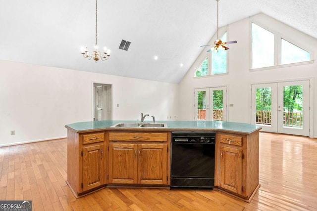 kitchen with sink, black dishwasher, a kitchen island with sink, high vaulted ceiling, and french doors