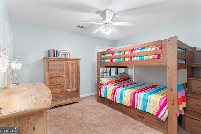 bedroom featuring light carpet and ceiling fan