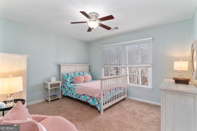 bedroom with light colored carpet and ceiling fan