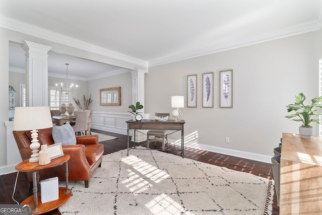 interior space with decorative columns, crown molding, dark wood-type flooring, and an inviting chandelier