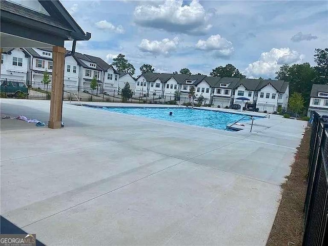 view of swimming pool with a patio area