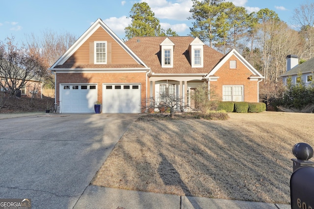 view of front of house with a front yard and a garage