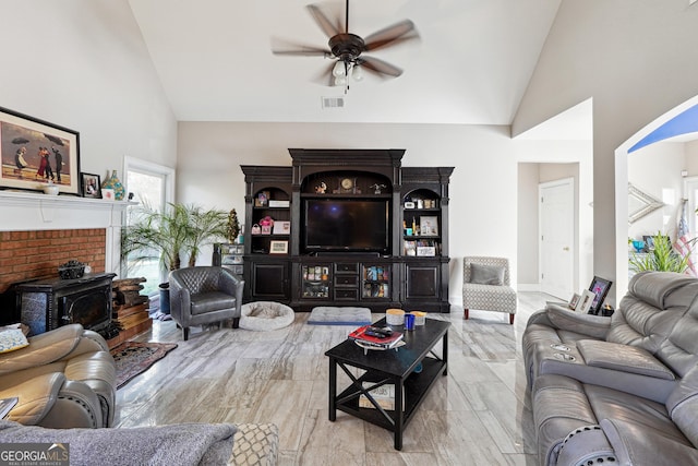 living room with ceiling fan, light hardwood / wood-style floors, and high vaulted ceiling