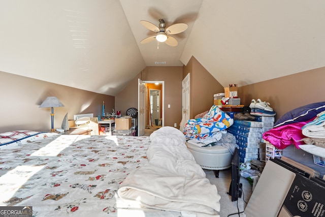 carpeted bedroom featuring ceiling fan and lofted ceiling