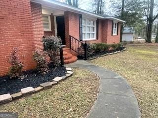 view of property exterior with a lawn