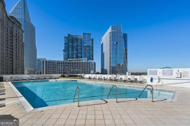 view of swimming pool with a patio