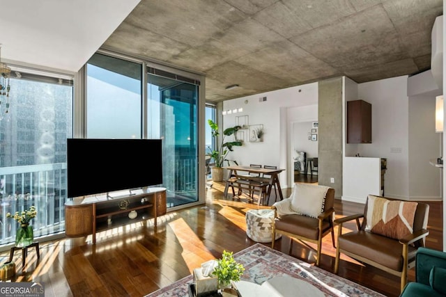 living room with floor to ceiling windows and wood-type flooring