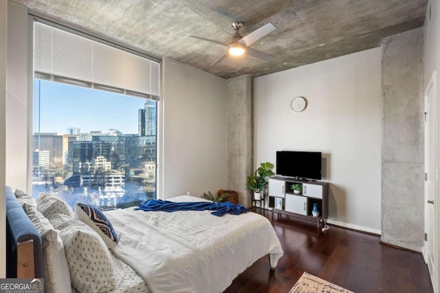 bedroom with dark hardwood / wood-style floors and ceiling fan