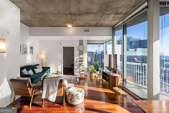 living room with hardwood / wood-style flooring and floor to ceiling windows