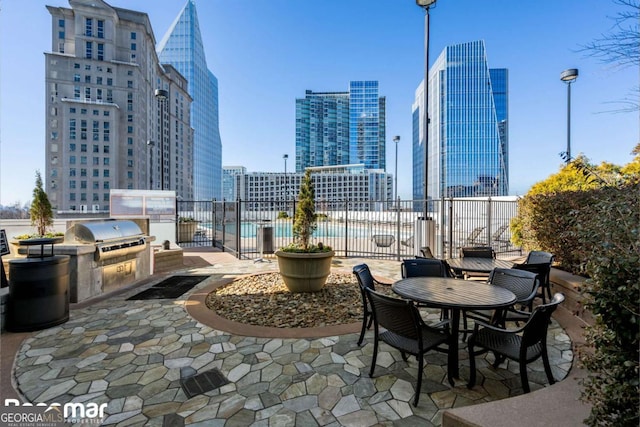 view of patio featuring an outdoor kitchen and area for grilling