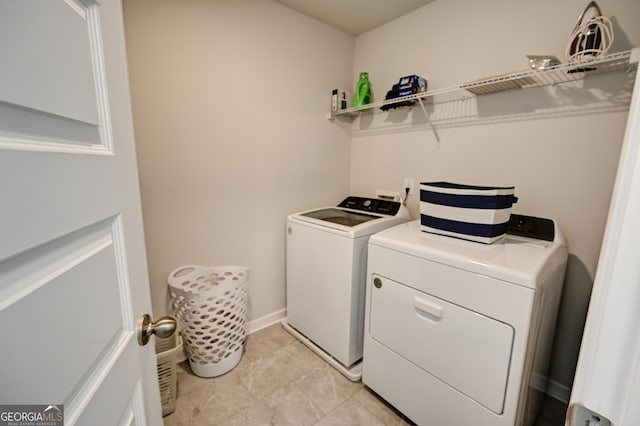 clothes washing area with washing machine and clothes dryer