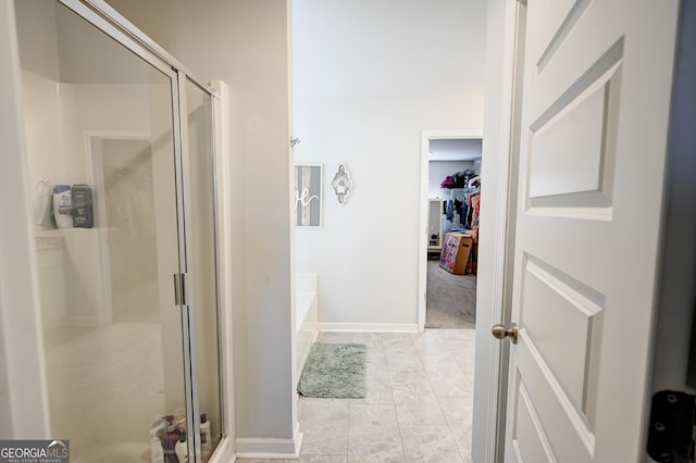 bathroom featuring separate shower and tub