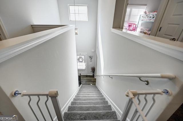 staircase featuring a wealth of natural light