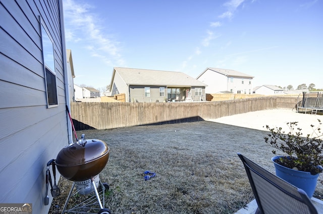 view of yard with a trampoline