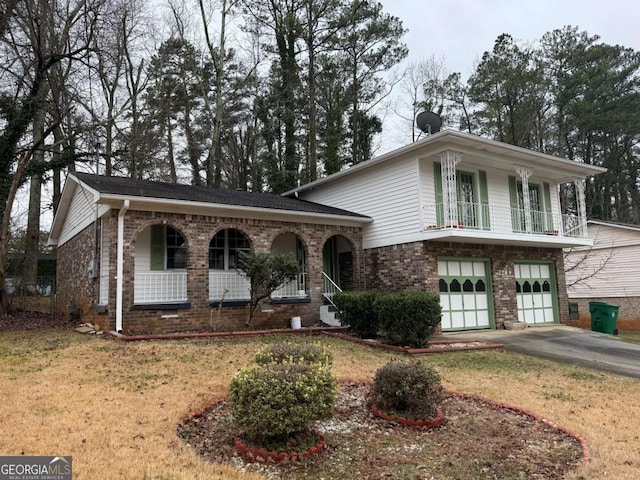 2289 Aurie Dr, Decatur, GA 30034 - view of front of house with a front lawn, a balcony, covered porch, and a garage