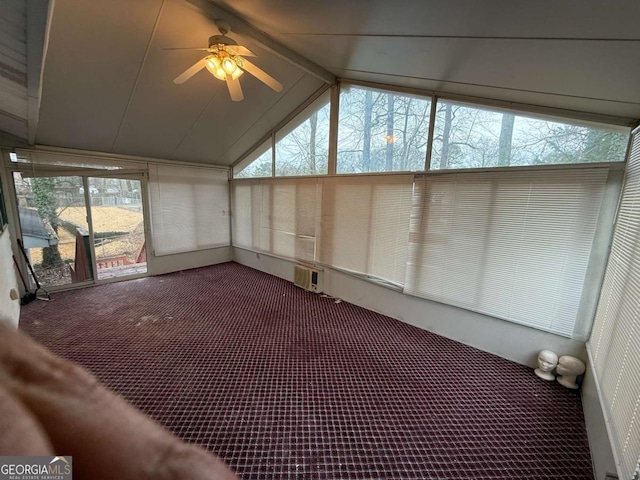 unfurnished sunroom with ceiling fan and lofted ceiling with beams