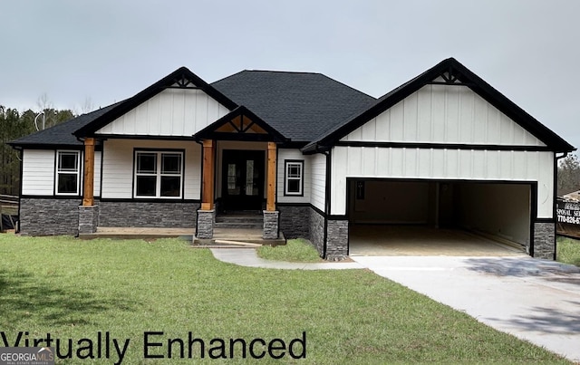 view of front of house with a garage and a front yard