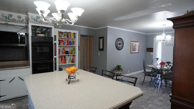 dining area with a notable chandelier and crown molding